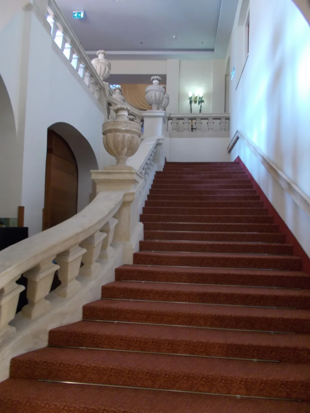 Interior staircase with carpeted steps