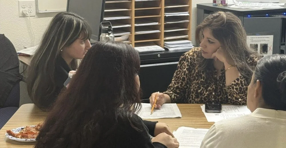 Seniors and their families meeting with ARISE staff about college applications
