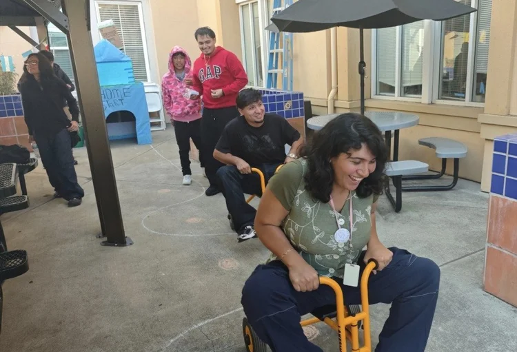 A trike race in the courtyard at Friday FUNday