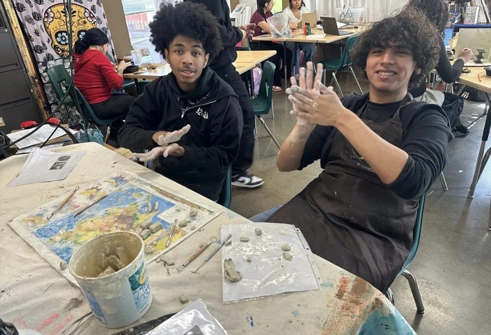 ARISE Art 2 and 3 students working with clay